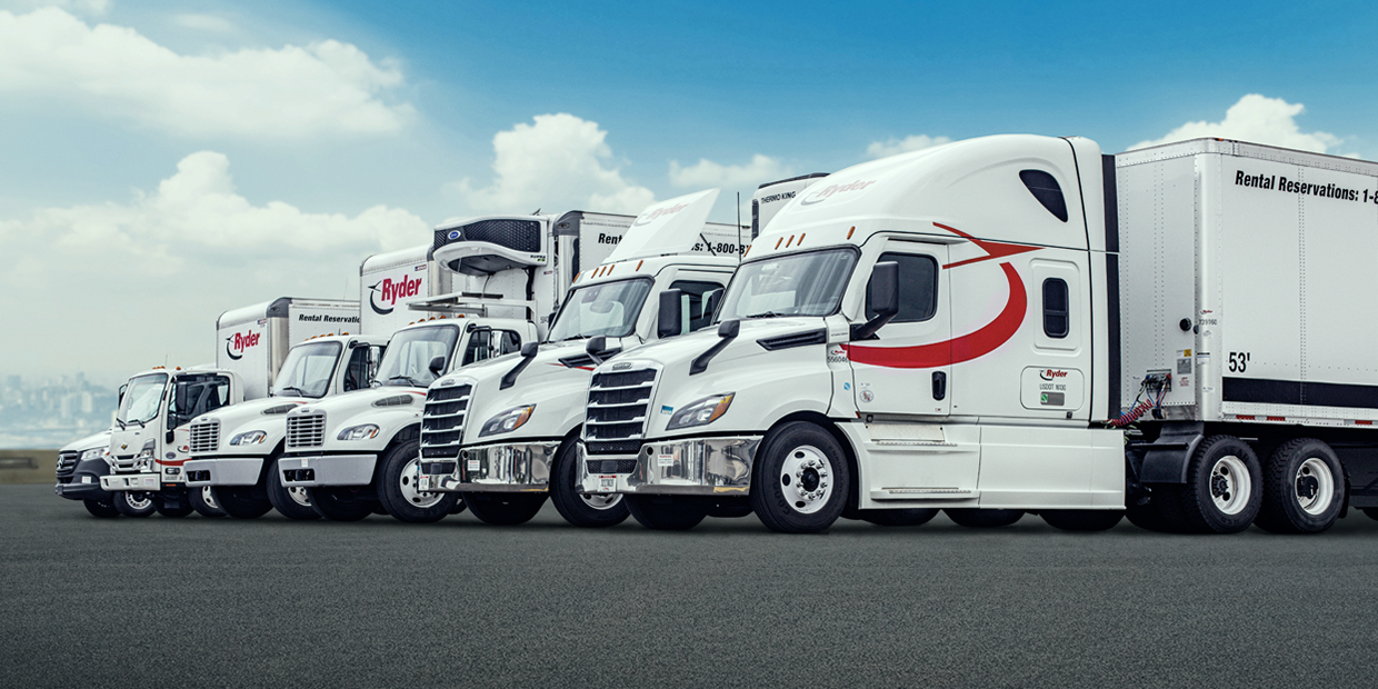 commercial trucks lined up at parking lot