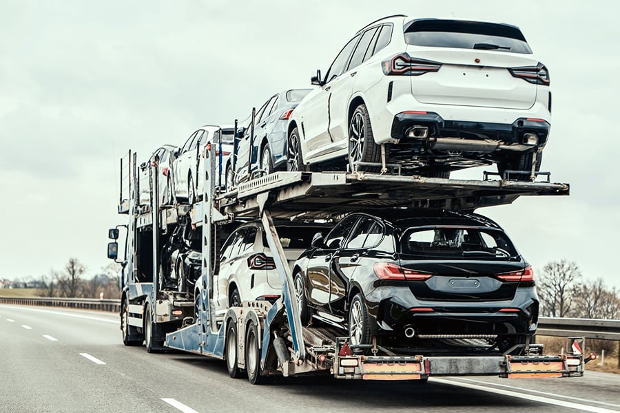 Brand new cars being transported to the dealership