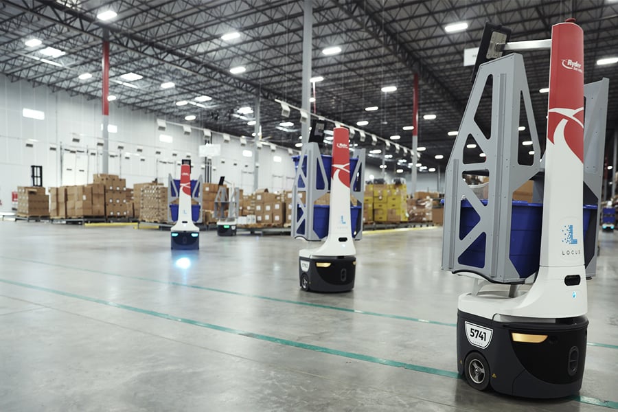 Robots sorting boxes in a Ryder warehouse