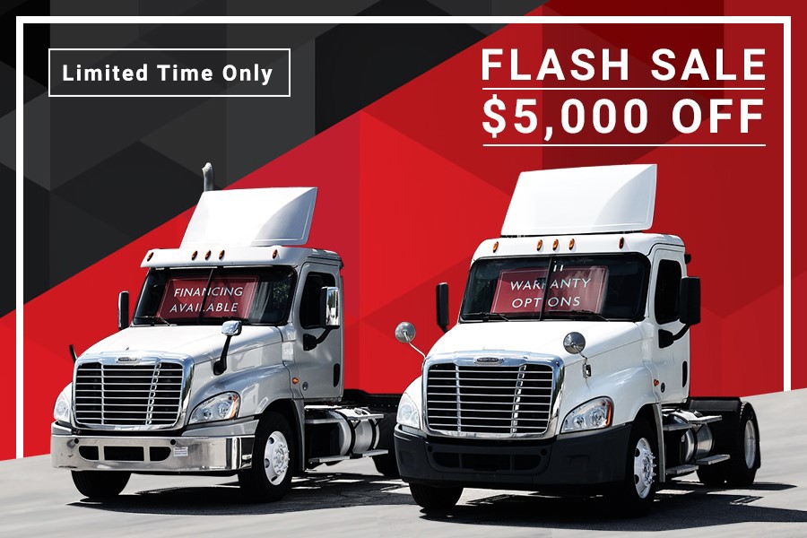 day cab trucks side by side with limited time offer text and $5,000 off flash sale text with red
